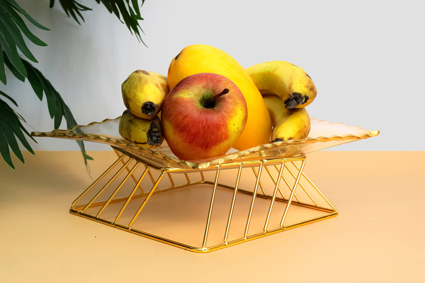 Glass fruit bowl with metal stand